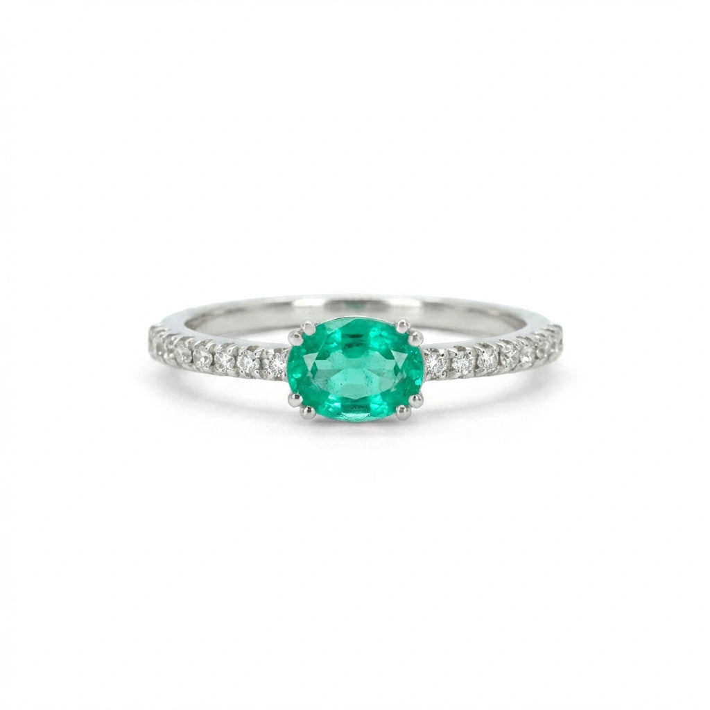 Subtle Oval Emerald Solitaire Ring with Diamond Pavé