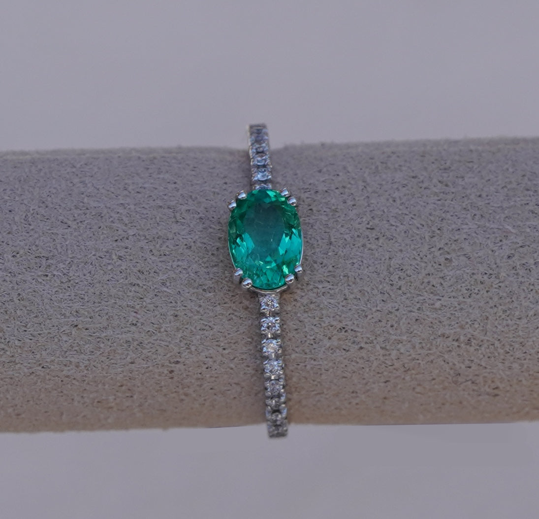 Subtle Oval Emerald Solitaire Ring with Diamond Pavé