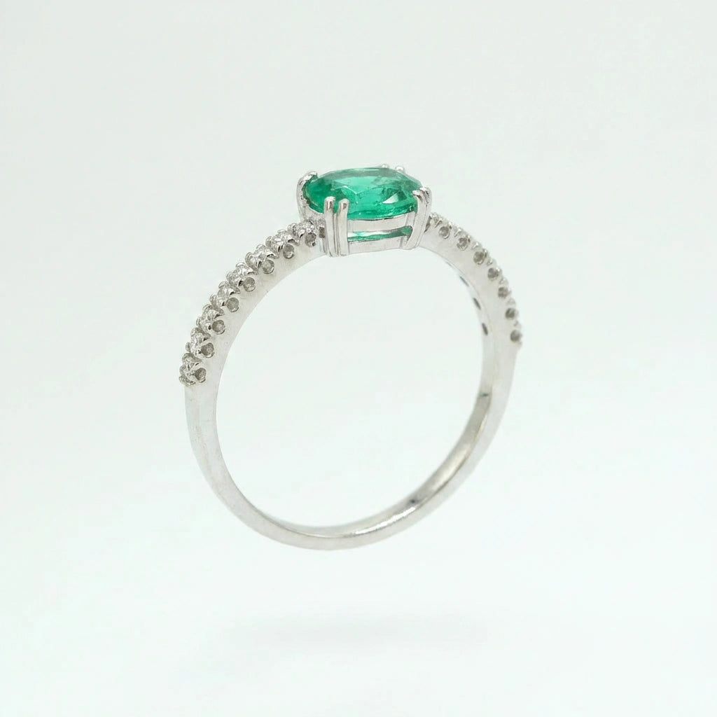 Subtle Oval Emerald Solitaire Ring with Diamond Pavé