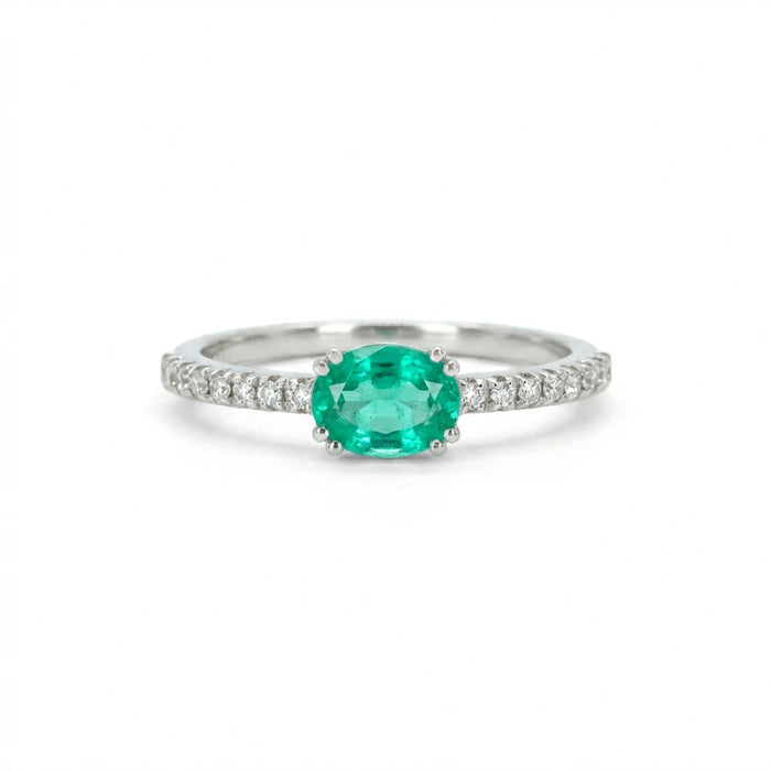 Subtle Oval Emerald Solitaire Ring with Diamond Pavé